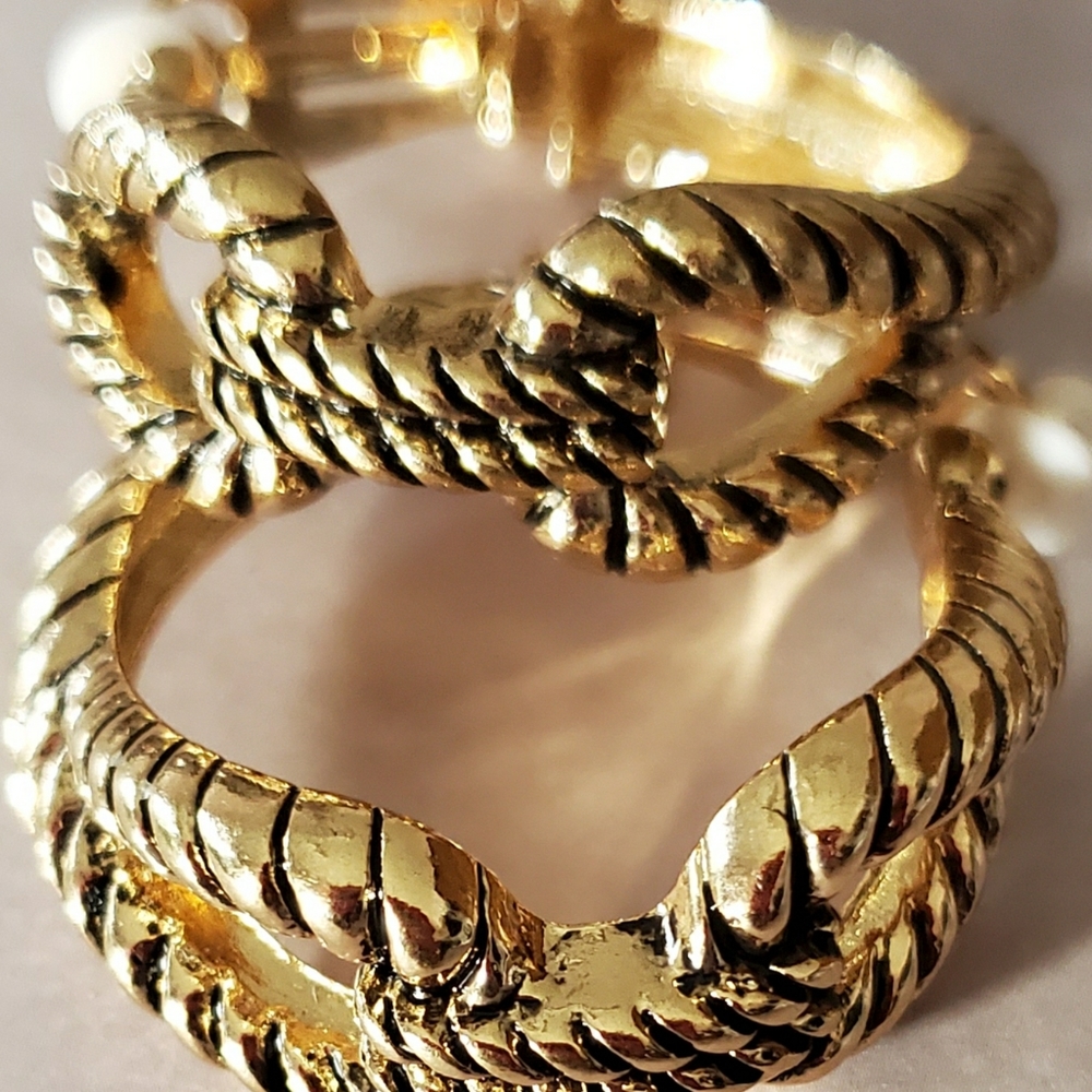 Metal knot clip on earrings